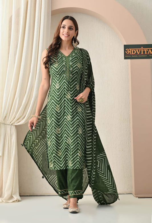 Woman wearing green cotton kurti pant dupatta set