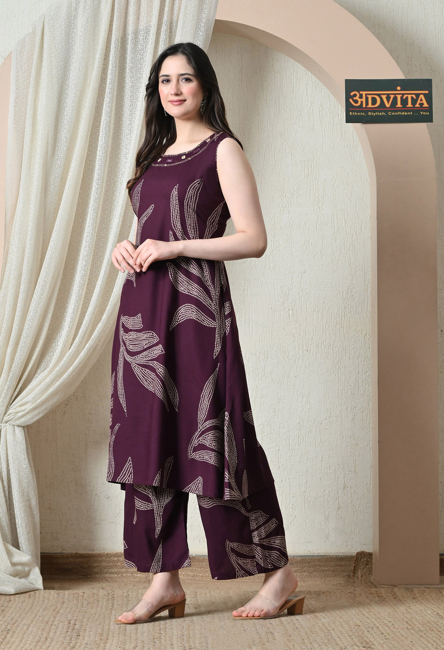 Side pose of wine purple printed kurta pant coord set