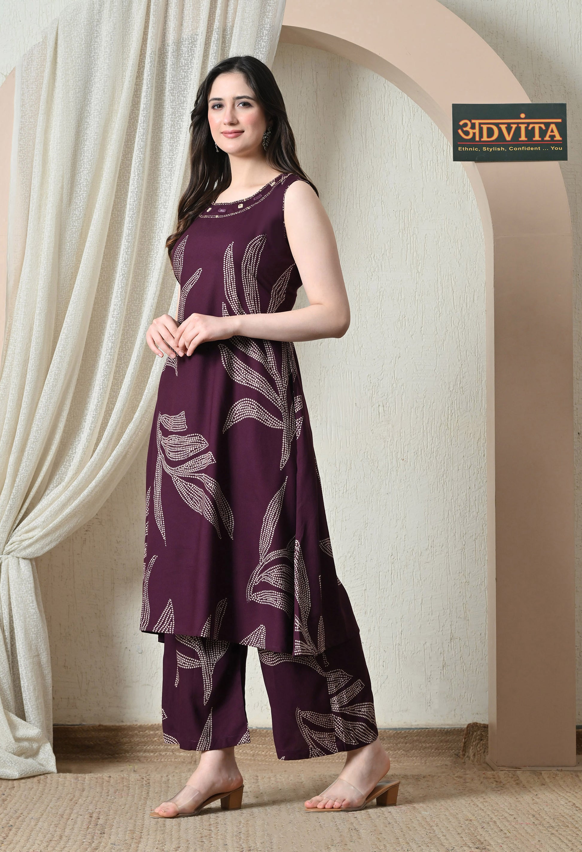 Side pose of wine purple printed kurta pant coord set