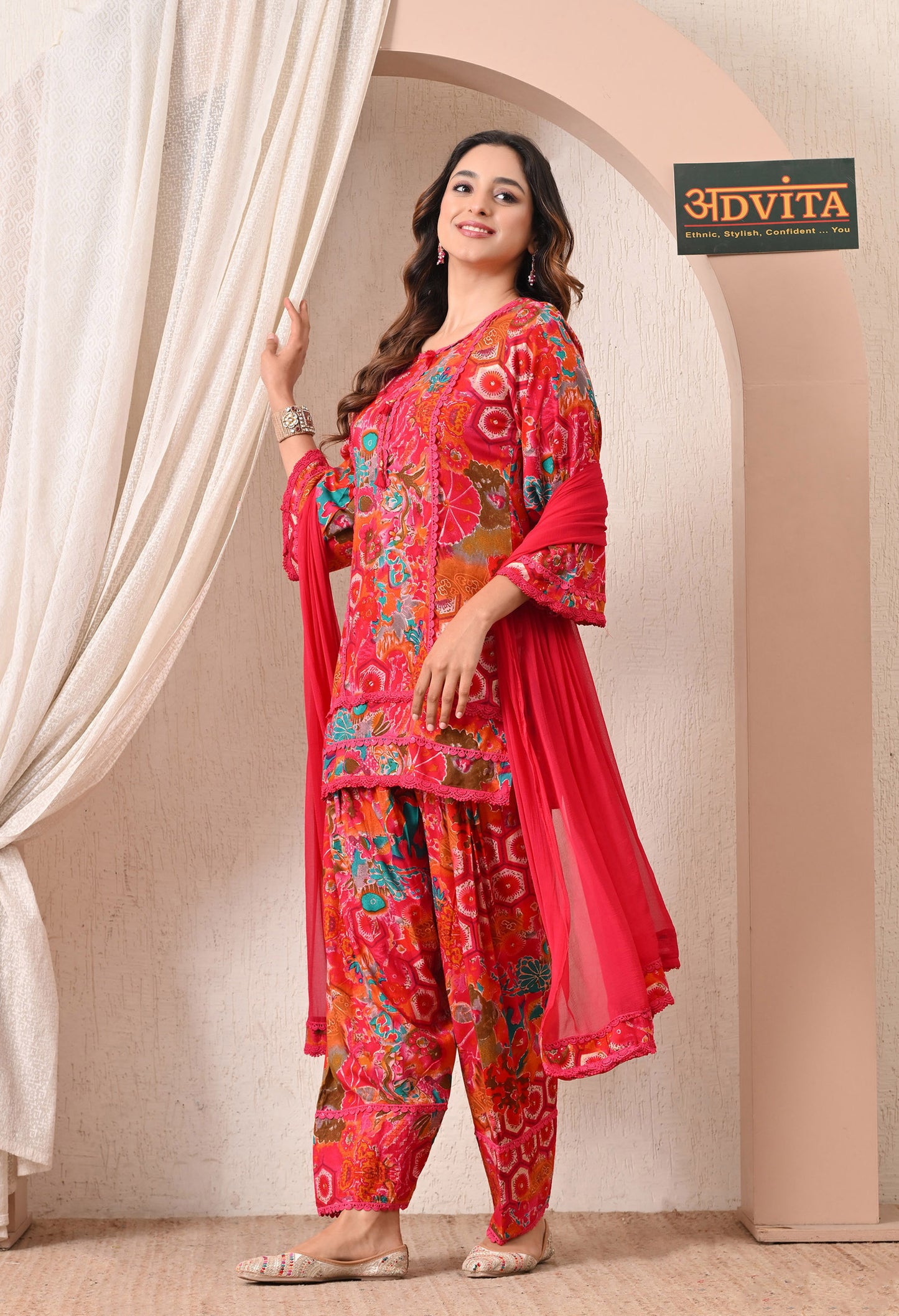 Woman wearing Advita Pink Multicolor Floral Print Rayon Cotton Farsi Salwar Suit
