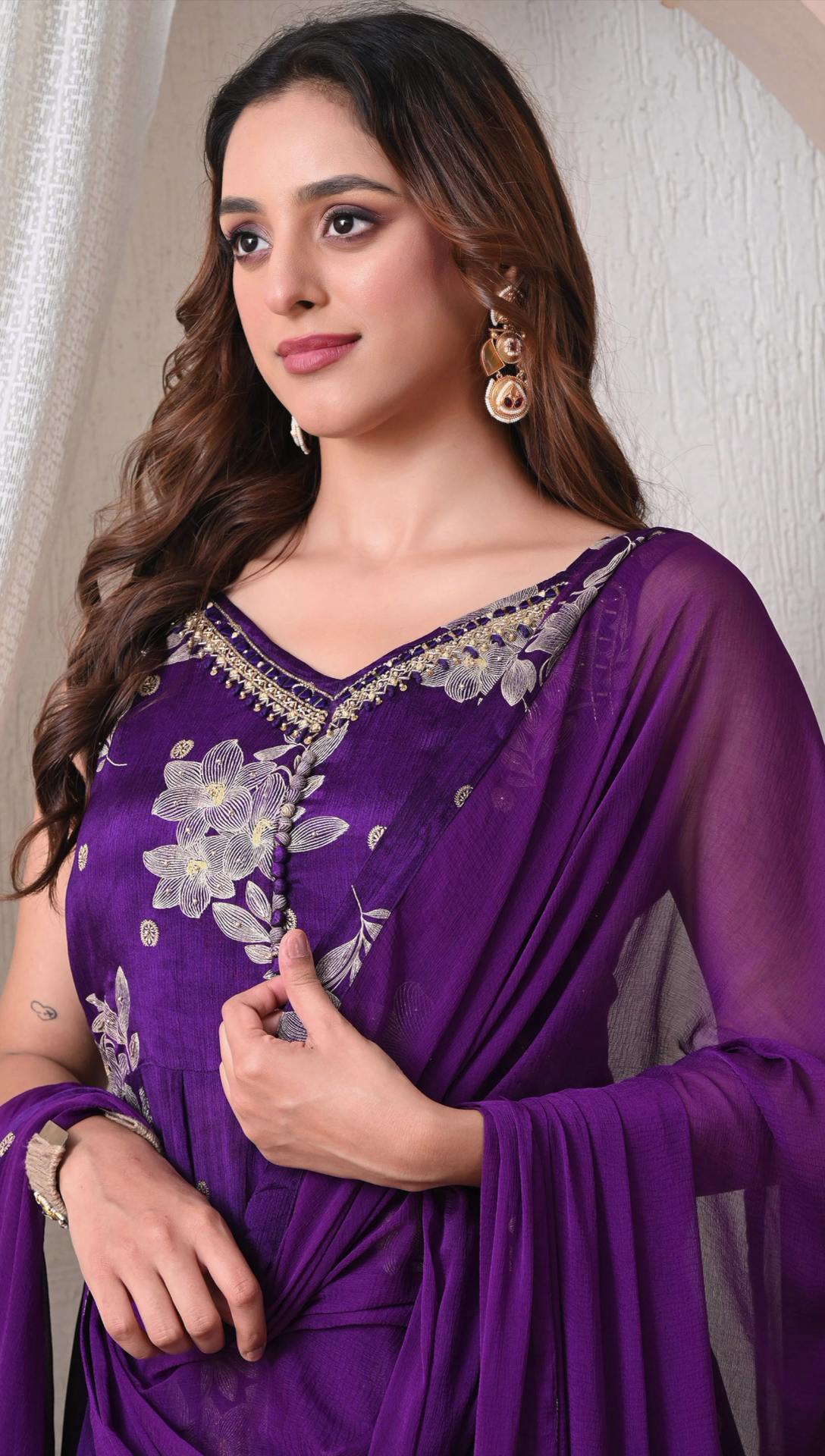 Closeup floral detailing on royal purple sharara suit