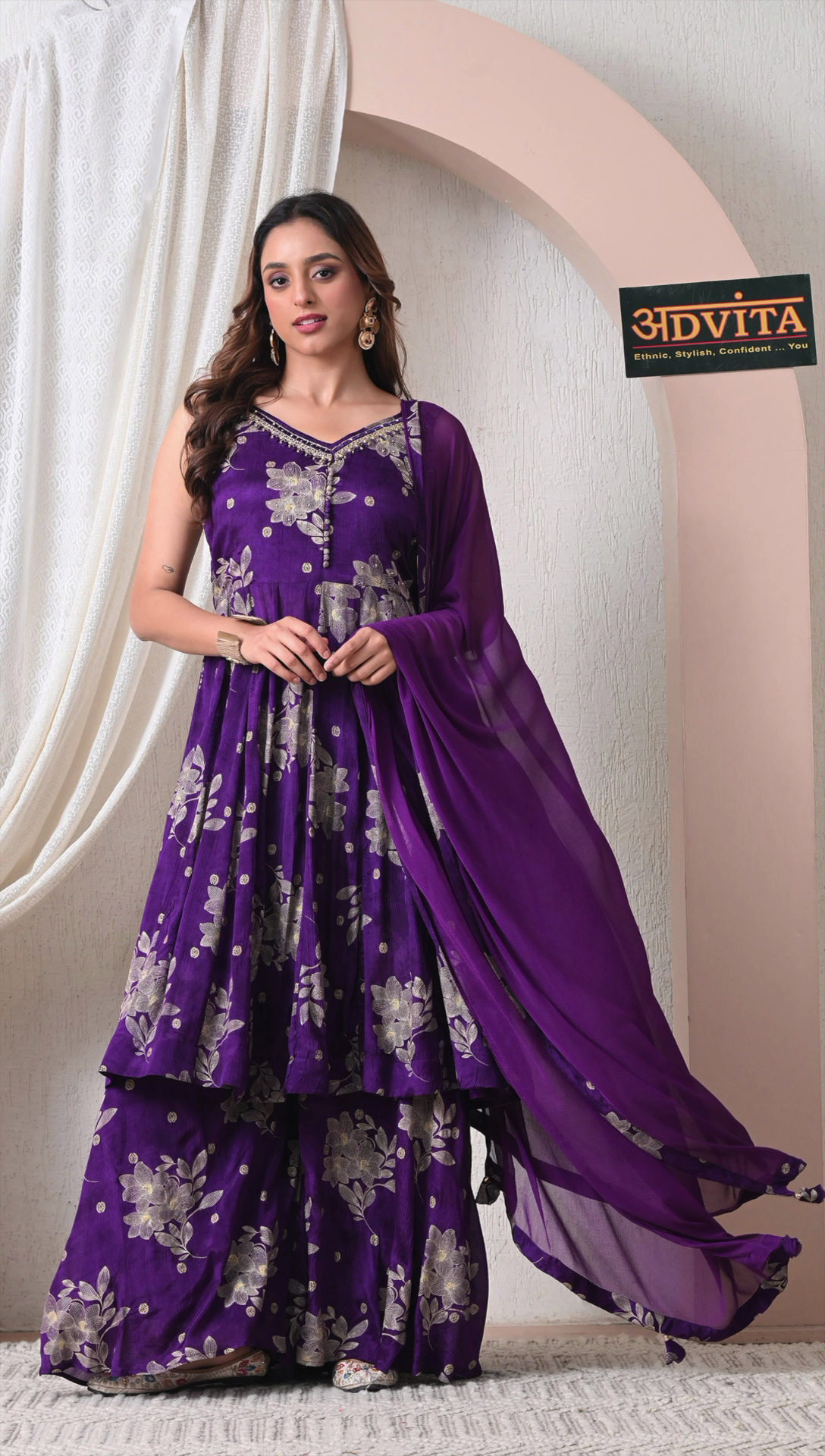 Woman wearing royal purple chinon silk sharara set with dupatta