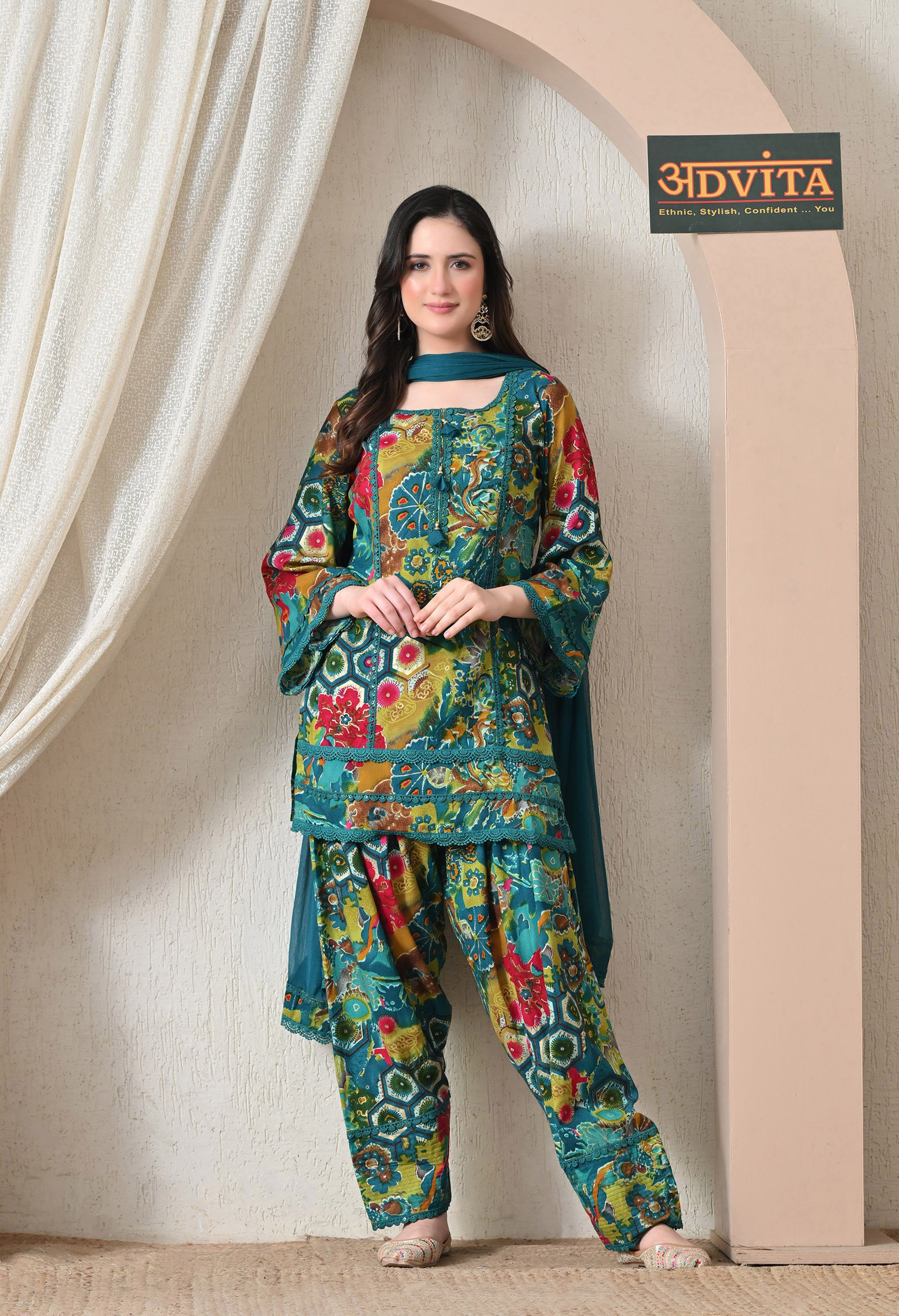 Woman wearing Advita Teal Multicolor Floral Print Rayon Cotton Farsi Salwar Suit